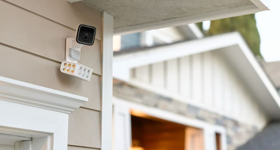 Vivint Spotlight Camera Pro attached to the side of a house