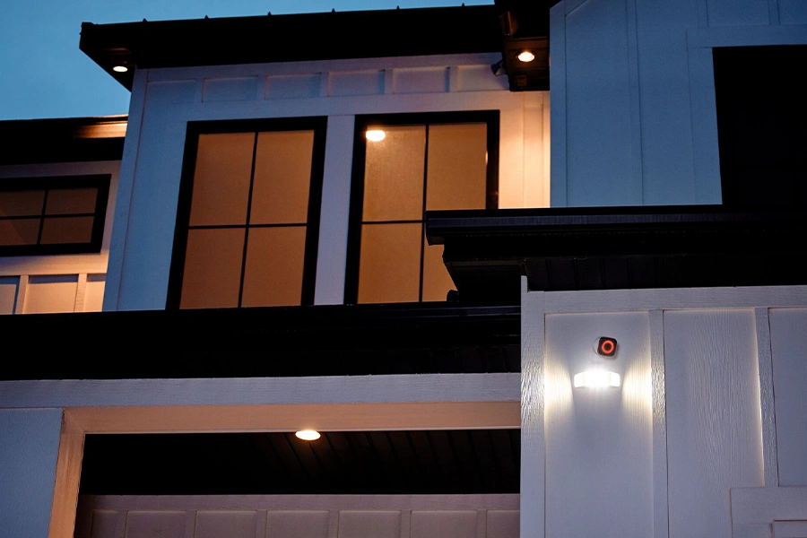 Vivint Spotlight Pro camera shining light at the front of a house